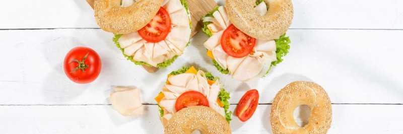 Bagel sandwich for breakfast topped with chicken ham from above Panorama in Stuttgart