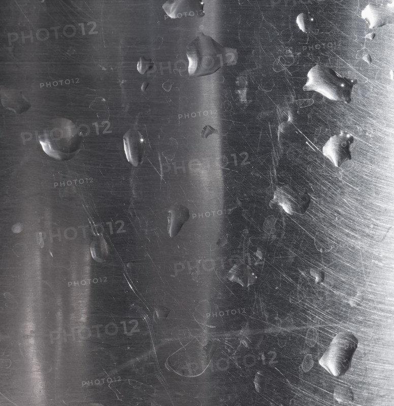 Water drops on grey steel texture background
