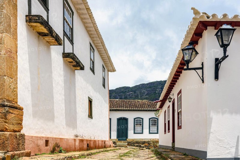 Cobblestone street in the historic city of Tiradentes in Minas Gerais among old colonial style houses