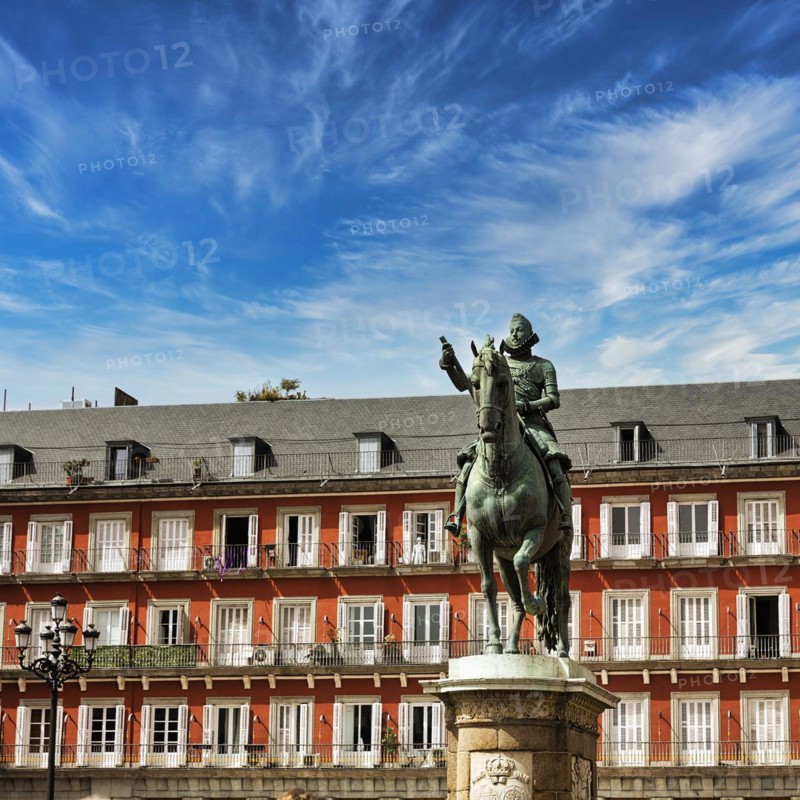 Equestrian statue of Philip III in front of residential buildings on the Plaza Mayor