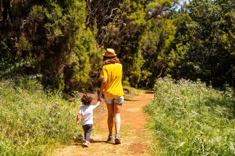 A mother with her son enjoying on the La Llania trekking trail in El Hierro