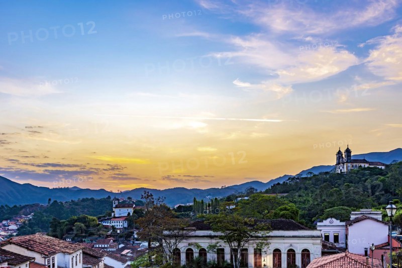 View of old houses and churches in colonial architecture from the 18th century at sunset in the historic city of Ouro Preto in Minas Gerais