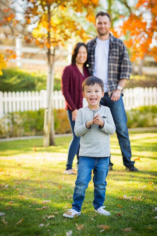 Outdoor portrait of multiethnic chinese and caucasian family