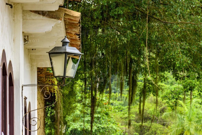 Colonial style house facades with old metal lantern in the historic town of Paraty