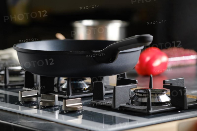 Low angle view of frying pan on a modern gas stove