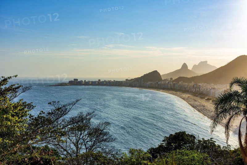 Copacabana beach and Rio de Janeiro mountains seen from above during summer sunset