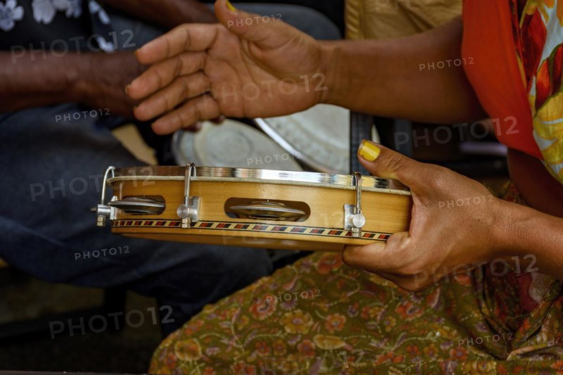 Tambourine being played by a ritimist during a samba performance in brazilian carnival in Rio de Janeiro