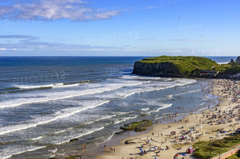 Beach on a beautiful sunny day in the summer of Torres city on the coast of Rio Grande do Sul state