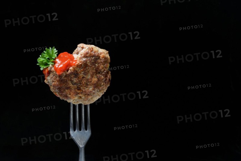 Homemade meatball on fork