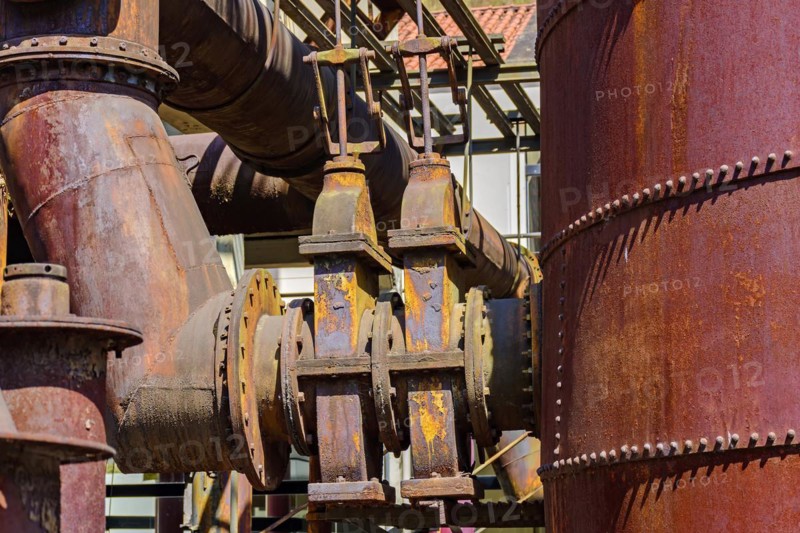 Corroded and rusty gears and pipes of old machinery for processing iron ore abandoned in Minas Gerais