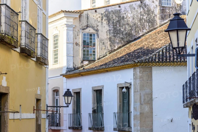 Facade of old preserved colonial-style houses on the slopes of Pelourinho in the city of Salvador
