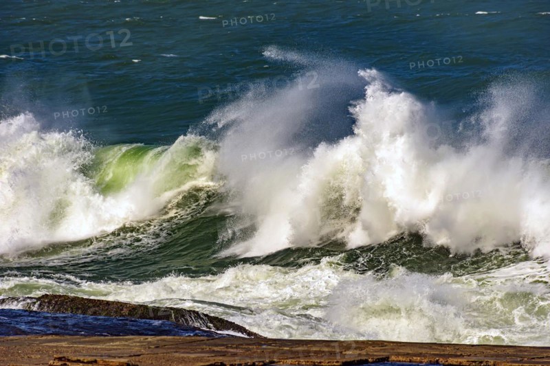 Big waves crashing on the beaches of Rio de Janeiro during a tropical storm in summer