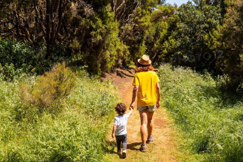 A mother with her son walking on the La Llania trekking trail in El Hierro