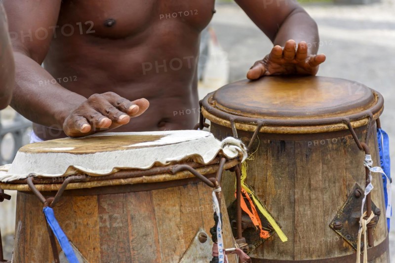 Musician playing atabaque which is a percussion instrument of African origin used in samba