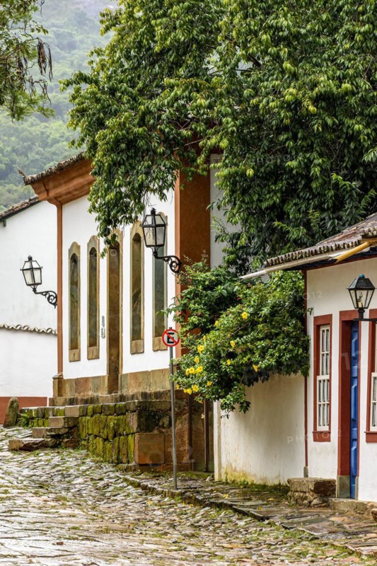 Colonial houses with colorful facades and cobblestone slopes in the historic city of Tiradentes