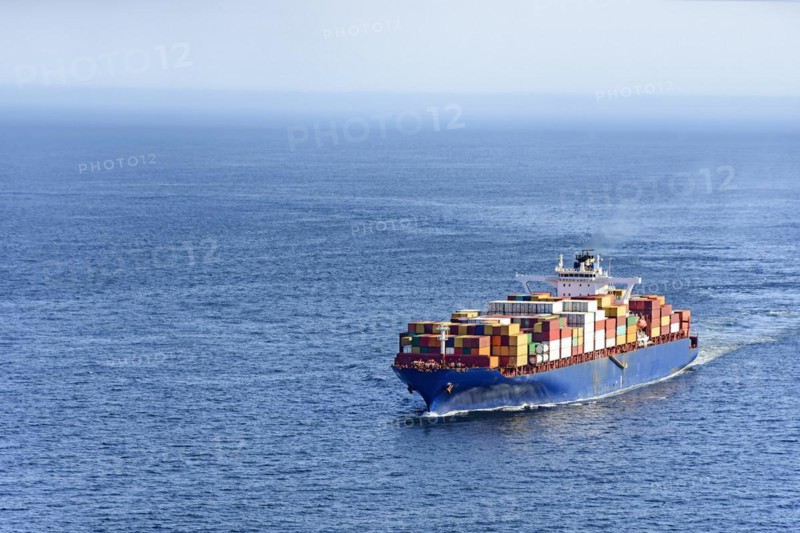 Cargo ship carrying several containers on the waters of the sea of rio de Janeiro
