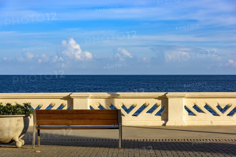 Wall and sidewalk overlooking the sea on a summer afternoon in the city of Salvador