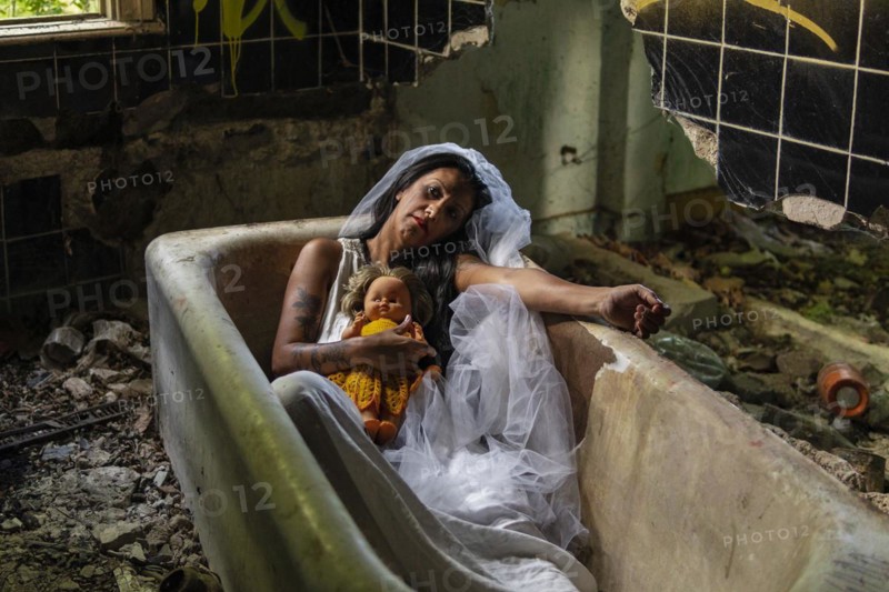 Deranged bride with a doll in a bathtub. Inspired by the traditional American legend of la llorona
