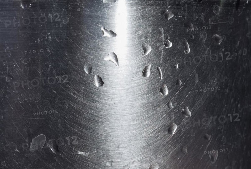 Water drops on grey steel texture background
