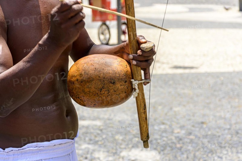 Musicians playing traditional instruments used in capoeira