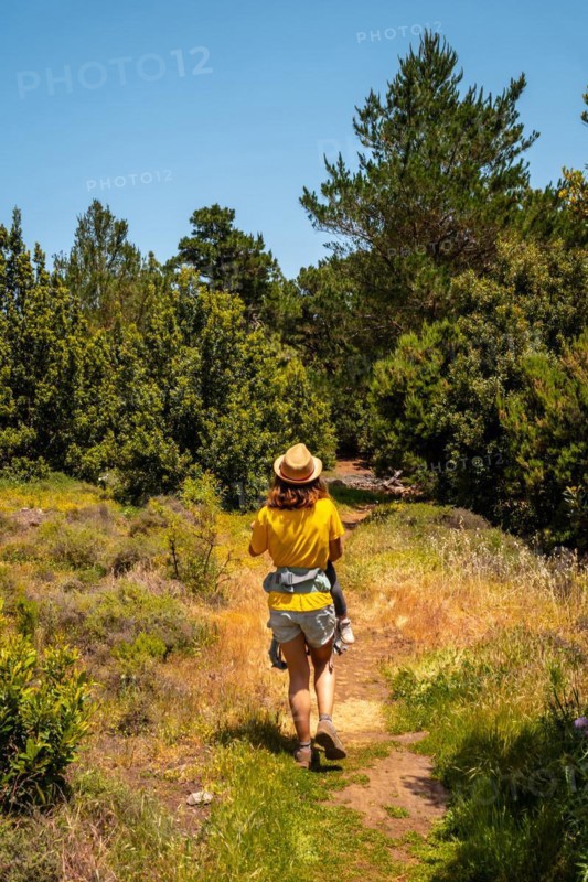 A mother with her son holding her son in her arms on the La Llania hiking trail in El Hierro