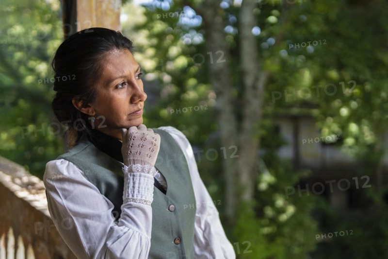 Profile portrait of a Latina woman dressed in traditional clothing