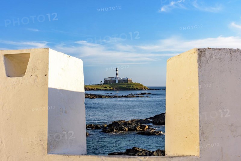 Historic Barra Lighthouse seen through the walls of the old fortress of Santa Maria in the city of Salvador in Bahia