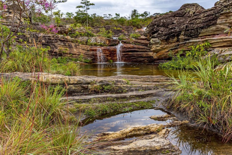 Beautiful and small cascade among the rocks and vegetation of the Biribiri environmental reserve in Diamantina