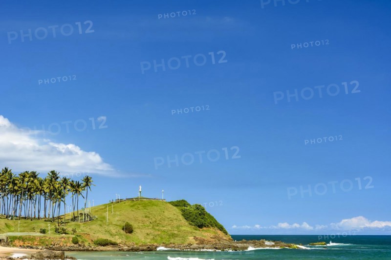 Seafront of the city of Salvador in Bahia with coconut trees and clear waters on a beautiful tropical sunny day.