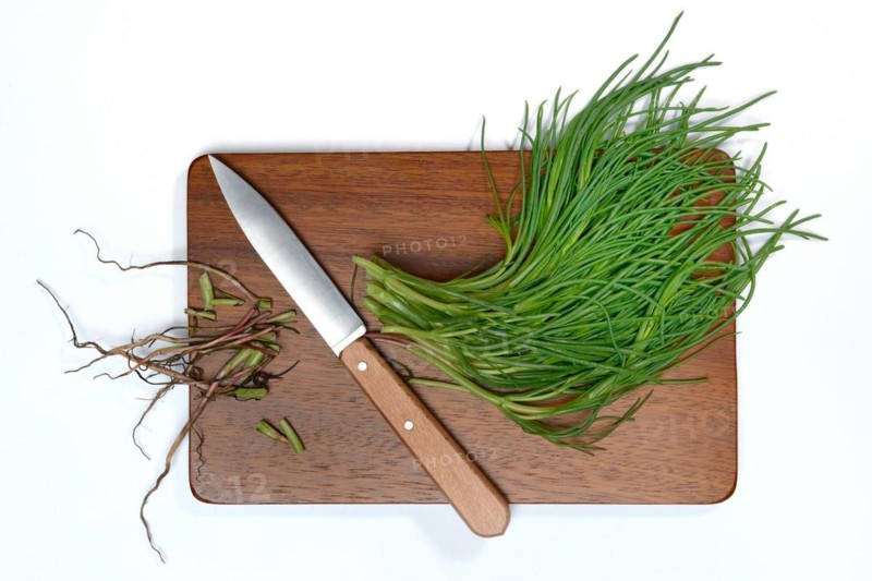 Monk's beard with knife on wooden board