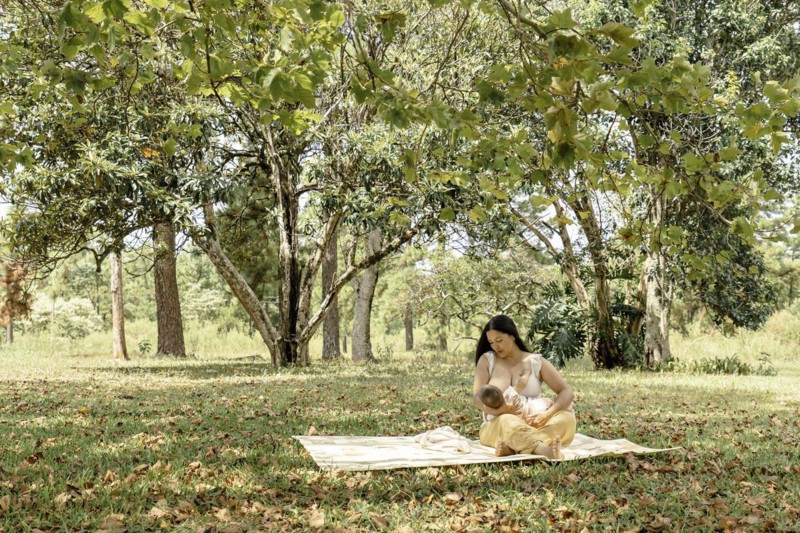 General shot of a mother breastfeeding her baby. Idyllic pictorial scene