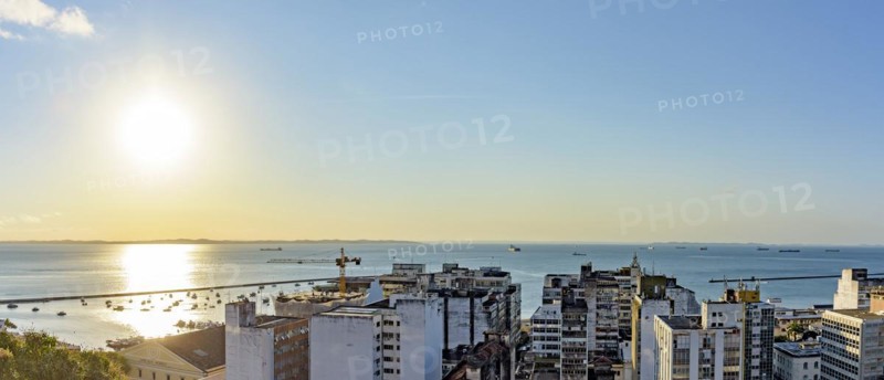 Buildings and port of the city of Salvador with the bay of All Saints in the background during sunset in Bahia state