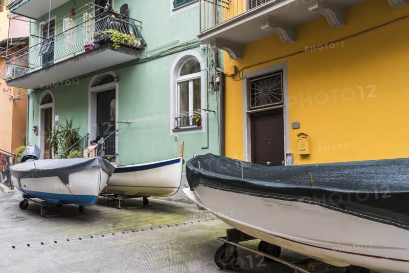 Boats parked in the street at Manarola