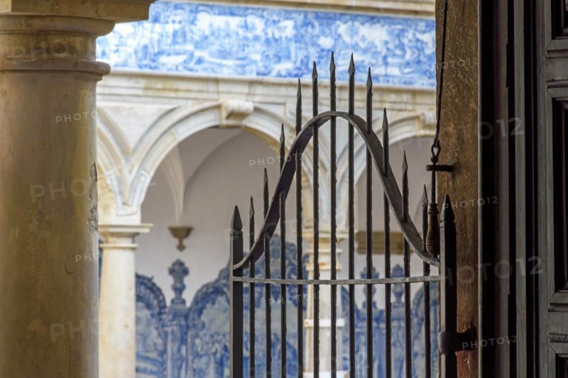 Arches and gate in the inner courtyard of an old historic convent in the city of Salvador
