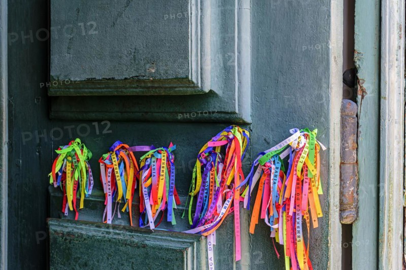 Famous ribbons of good luck from Our Lord of Bonfim tied to the door of the church in Salvador