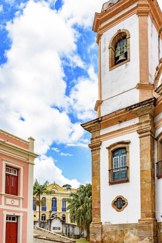 Old cobblestone street with houses and church in colonial architecture in the famous city of Ouro Preto in Minas Gerais
