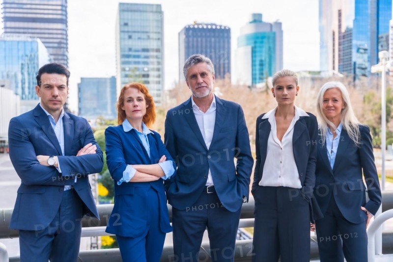 Professional Business Executives Posing for Corporate Portraits in Downtown Setting