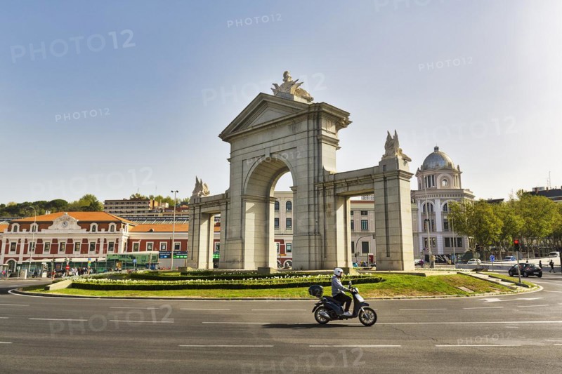 Monumental gate Puerta de San Vicente in a roundabout