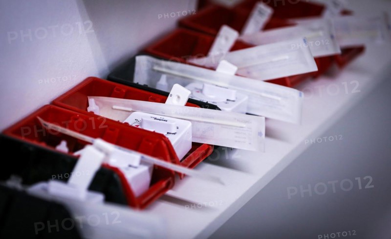 Rapid tests with stopwatches are ready in trays for use in a COVID-19 vaccination and testing centre at Autohaus Olsen in Iserlohn