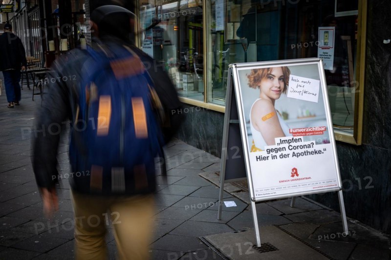 A poster at a pharmacy advertises the possibility to get vaccinated at pharmacies in Duesseldorf