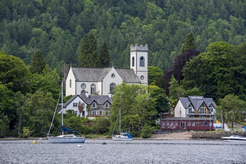 Kenmore Parish Church and sailing boats in Loch Tay