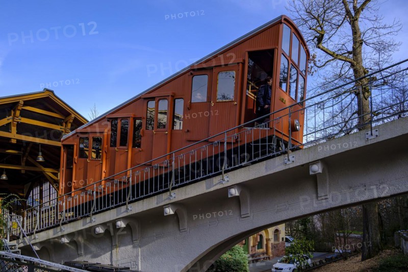 A renovated car of the upper Heidelberg mountain railway leaves the Molkenkur station on the Kleiner Gaisberg towards the Koenigstuhl