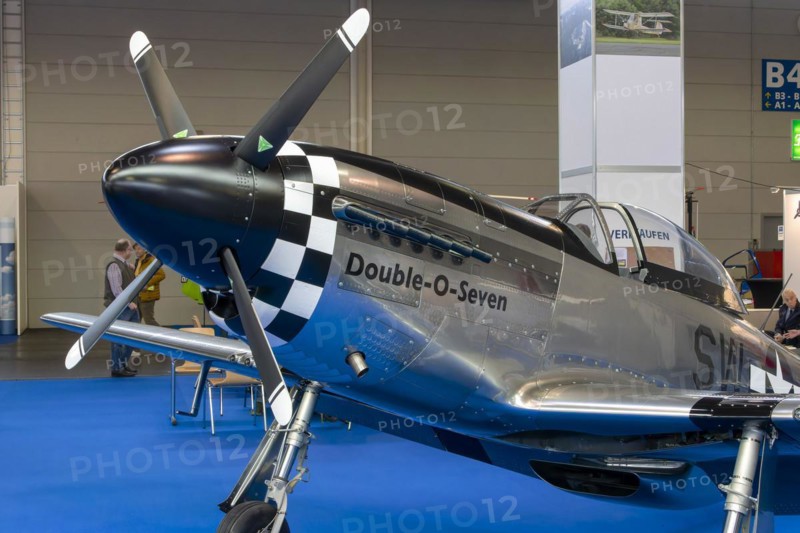 The front part of the aircraft with the propeller with engine cowling