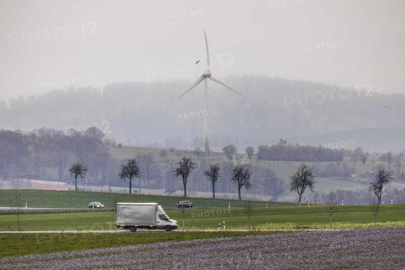 Cars driving along a country road in Meuselwitz