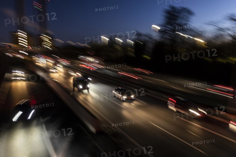 Traffic on the A100 looms at blue hour in Berlin