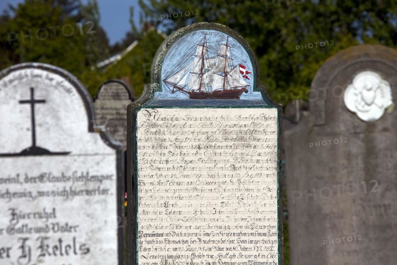 Tombstones of sailors at the graveyard of the St. Laurentii church at Suederende on the island of Foehr