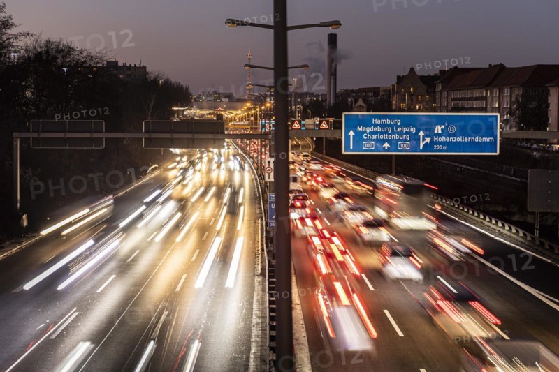 Congested traffic on the A100 looms at blue hour in Berlin