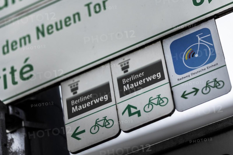Directional signs point to the Berlin Wall Trail