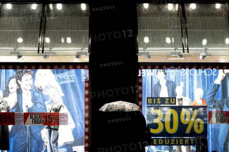 Signs indicating discounts stand out at a shopping centre on Schlossstrasse in Berlin