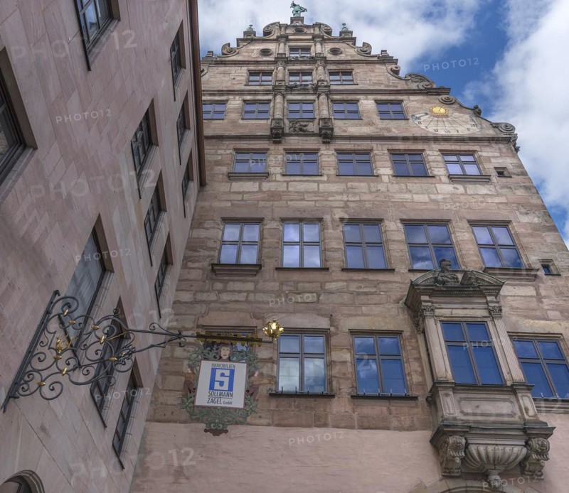 Historical nose sign on a residential and commercial building